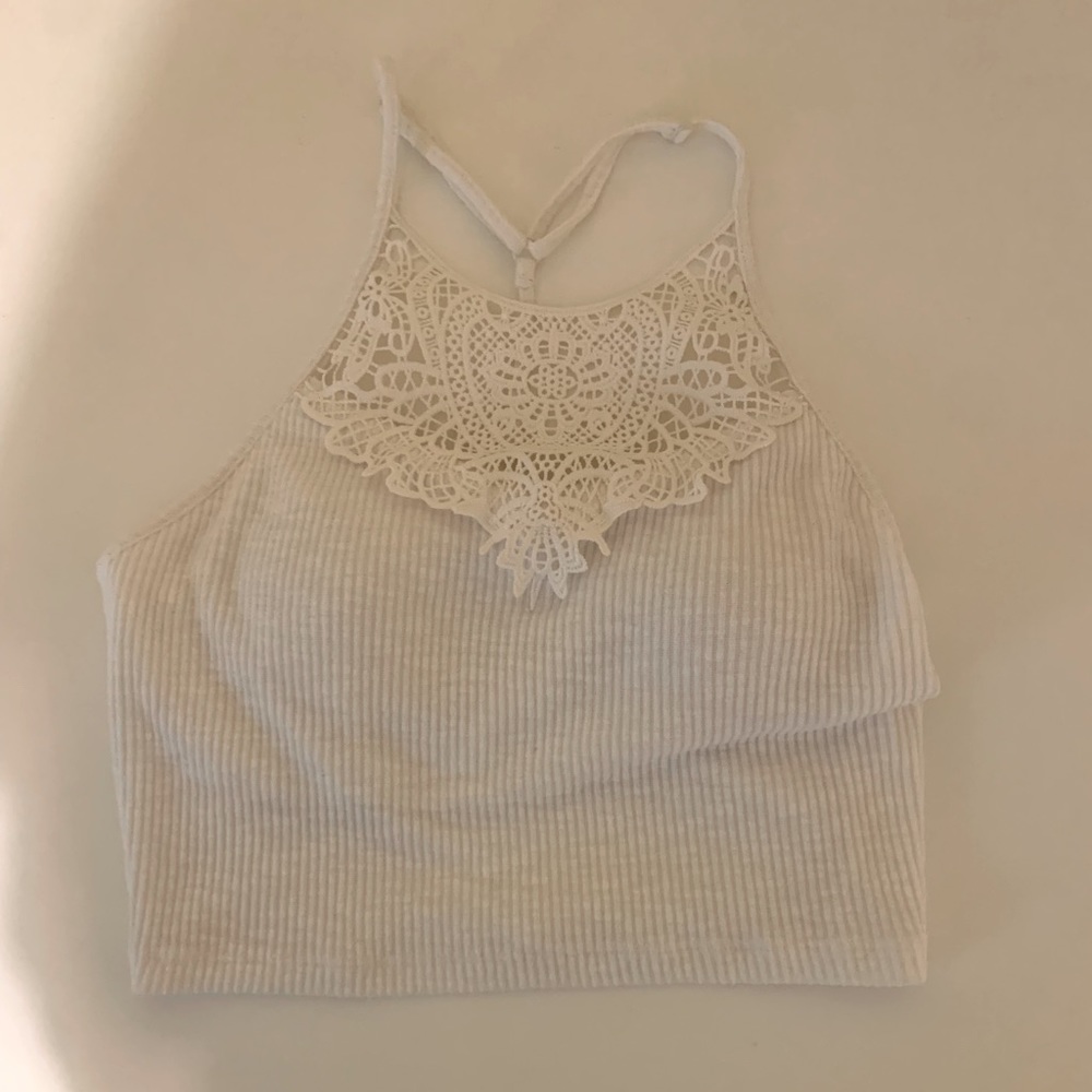 Small white halter top, never worn, very soft material.